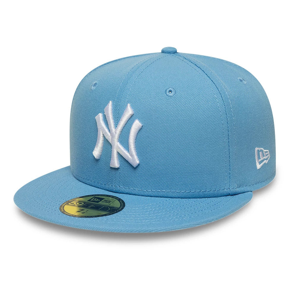 New York Yankees MLB Blue New Era 59FIFTY Fitted Cap, three-quarter view showing the white raised embroidered NY logo on the front panel, matching blue flat visor with a gold 59FIFTY size sticker, and New Era flag logo on the left side.