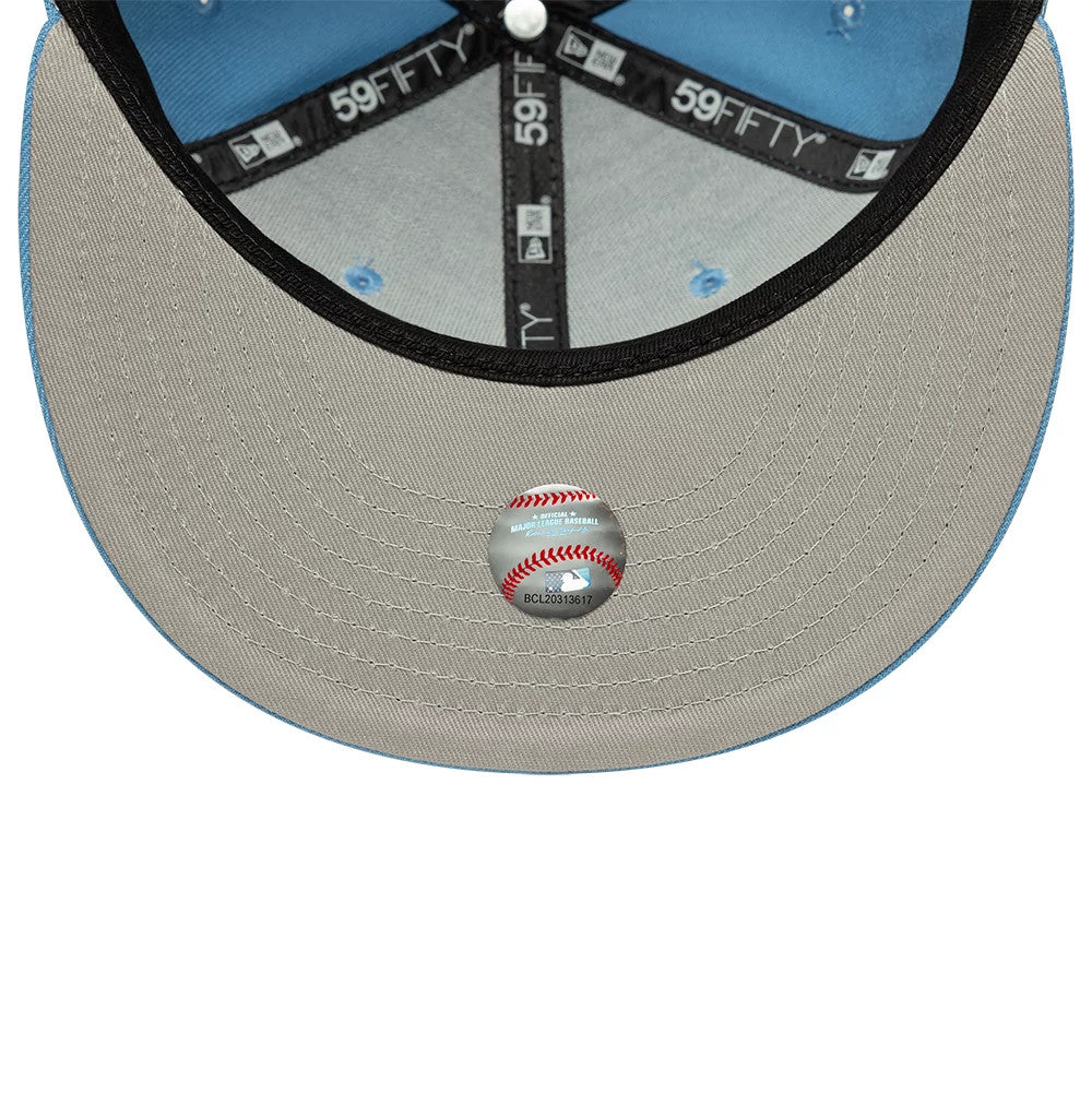 New York Yankees MLB Blue New Era 59FIFTY Fitted Cap, inside view showing a grey undervisor with a baseball graphic sticker at the centre, black 59FIFTY taping along the seams, and a light blue sweatband lining the crown.