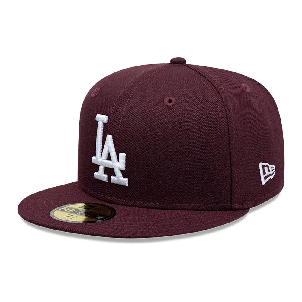 LA Dodgers MLB Dark Purple New Era 59FIFTY Fitted Cap, three-quarter view showing the white raised embroidered LA logo on the front panel, flat dark purple visor with a gold 59FIFTY size sticker, and New Era flag logo on the left side.