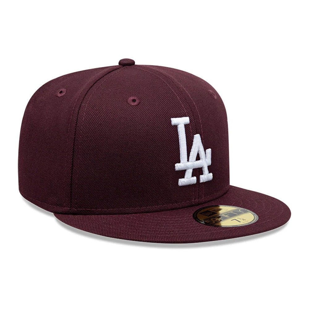 LA Dodgers MLB Dark Purple New Era 59FIFTY Fitted Cap, three-quarter view showing the white embroidered LA logo on the front panel, complemented by a dark purple flat visor with a gold 59FIFTY size sticker near the centre.