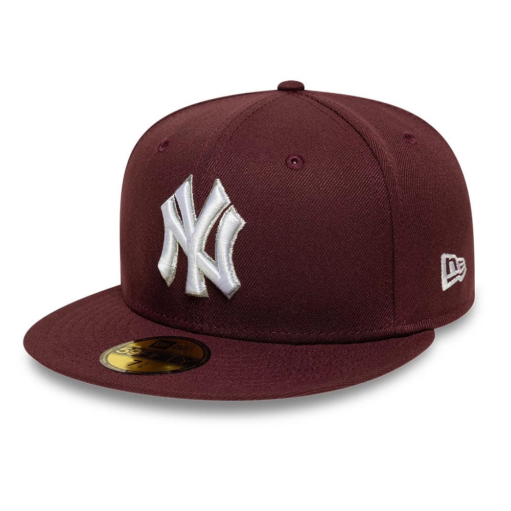 New York Yankees MLB Dark Purple New Era 59FIFTY Fitted Cap, three-quarter view showing raised white NY logo embroidery on the front panel, matching dark purple flat visor with a gold 59FIFTY size sticker on top.