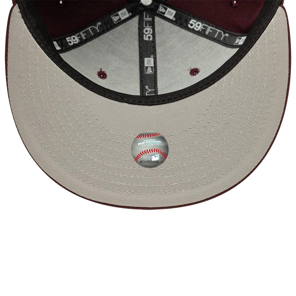 Pictured is this MLB New York Yankees 59FIFTY Fitted cap in dark purple. 2