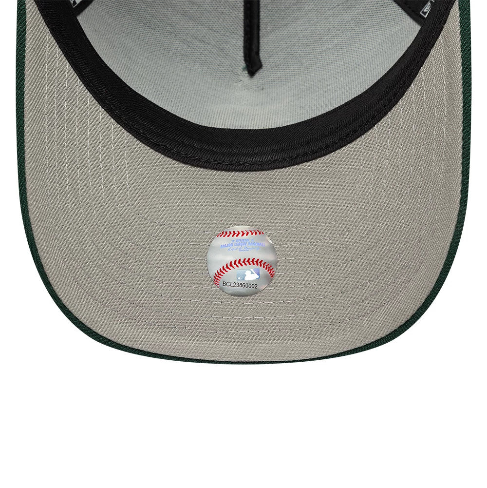 Detroit Tigers MLB Dark Green New Era 9FORTY A-Frame Adjustable Cap, inside view highlighting the grey undervisor, black sweatband, dark green edge detail and a round sticker with red stitching design, positioned centrally underneath the visor.