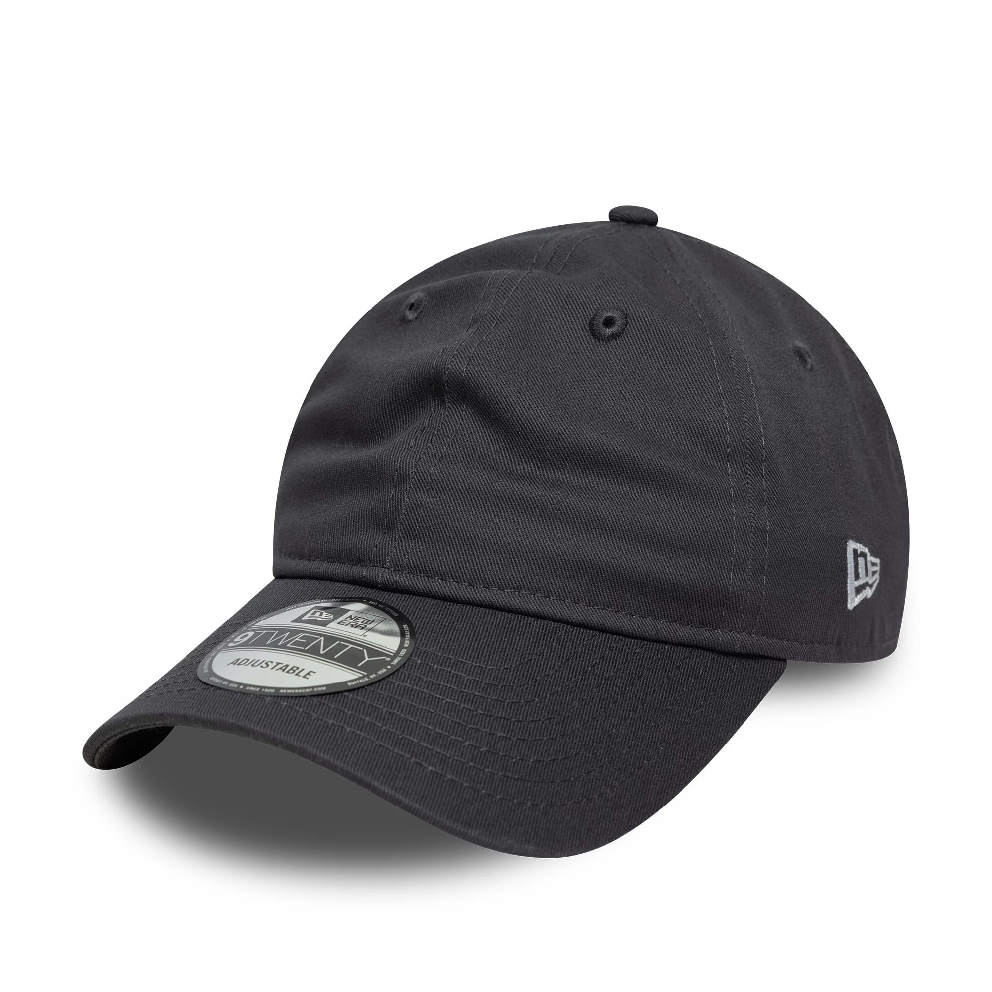 New Era Dark Grey New Era 9TWENTY Adjustable Cap, three-quarter view showing the black curved visor with a 9TWENTY size sticker, grey New Era flag logo embroidered on the left side, and a soft, unstructured dark grey crown with eyelets.