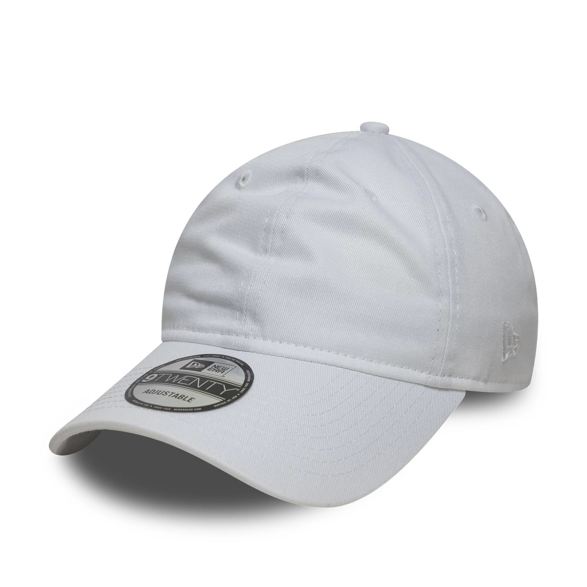 New Era White 9TWENTY Adjustable Cap, three-quarter view showing the curved visor with a 9TWENTY size sticker, an embroidered New Era flag logo on the left side, and eyelets on each front panel for added detail.