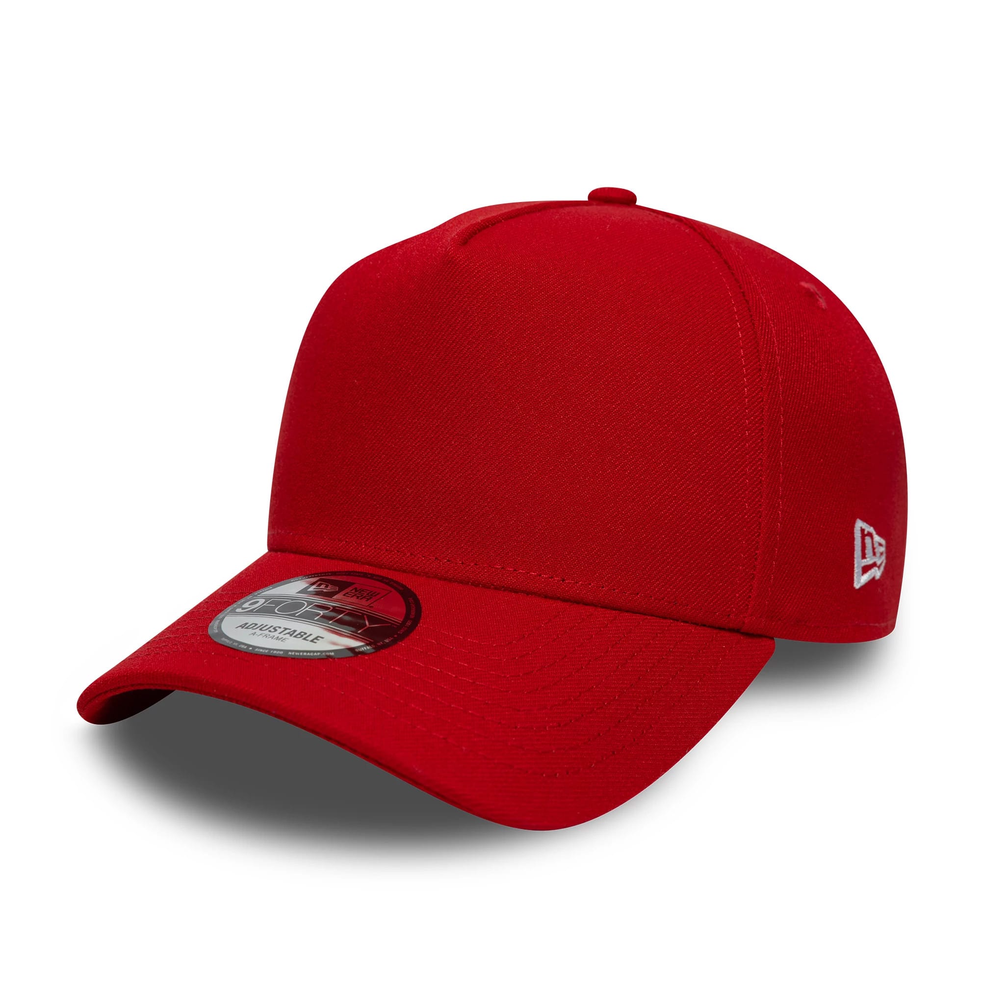 New Era Red 9FORTY A-Frame Adjustable Cap, three-quarter view showing the red curved visor with a 9FORTY size sticker, a plain structured red crown with eyelets, and the white embroidered New Era flag logo on the left side.