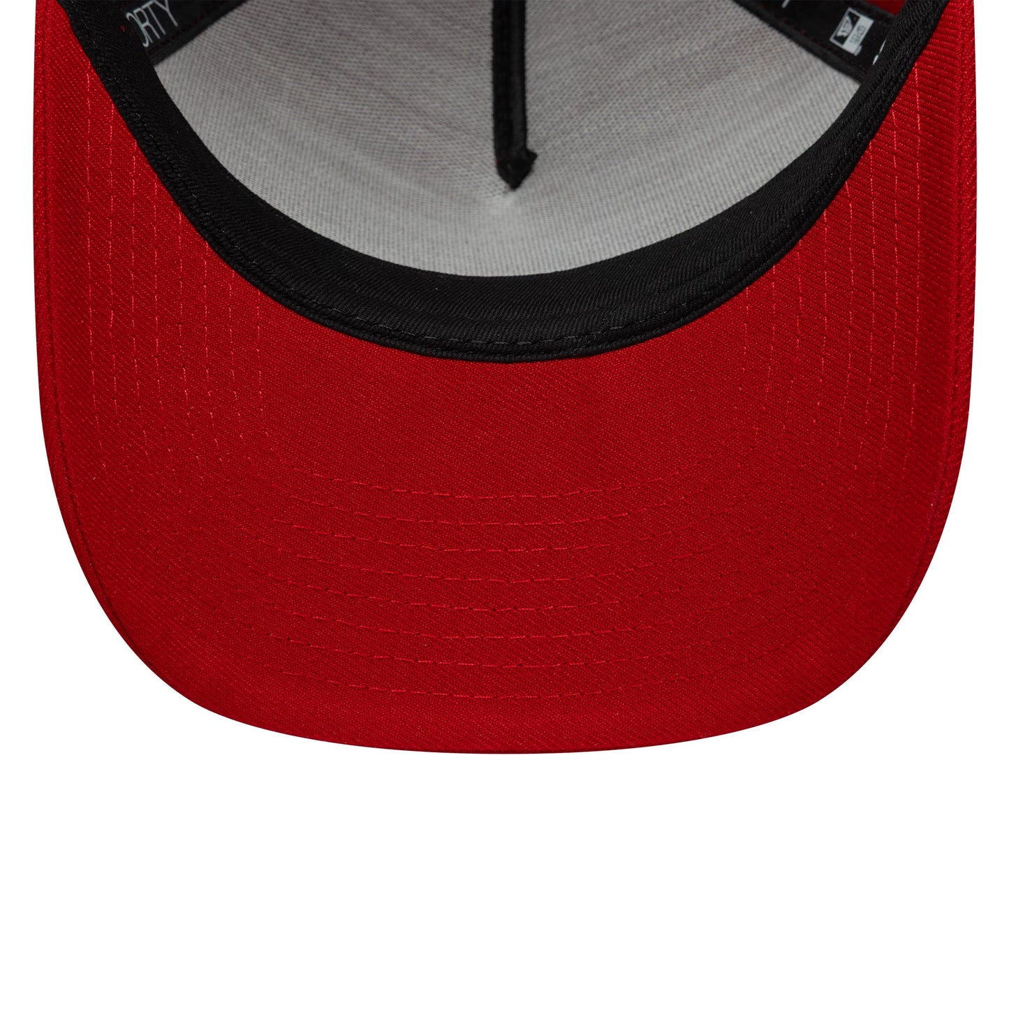 New Era Red 9FORTY A-Frame Adjustable Cap, inside view showing the black sweatband against a grey interior, red undervisor with neat stitching, and black taping along the seams, highlighting the detailed construction.