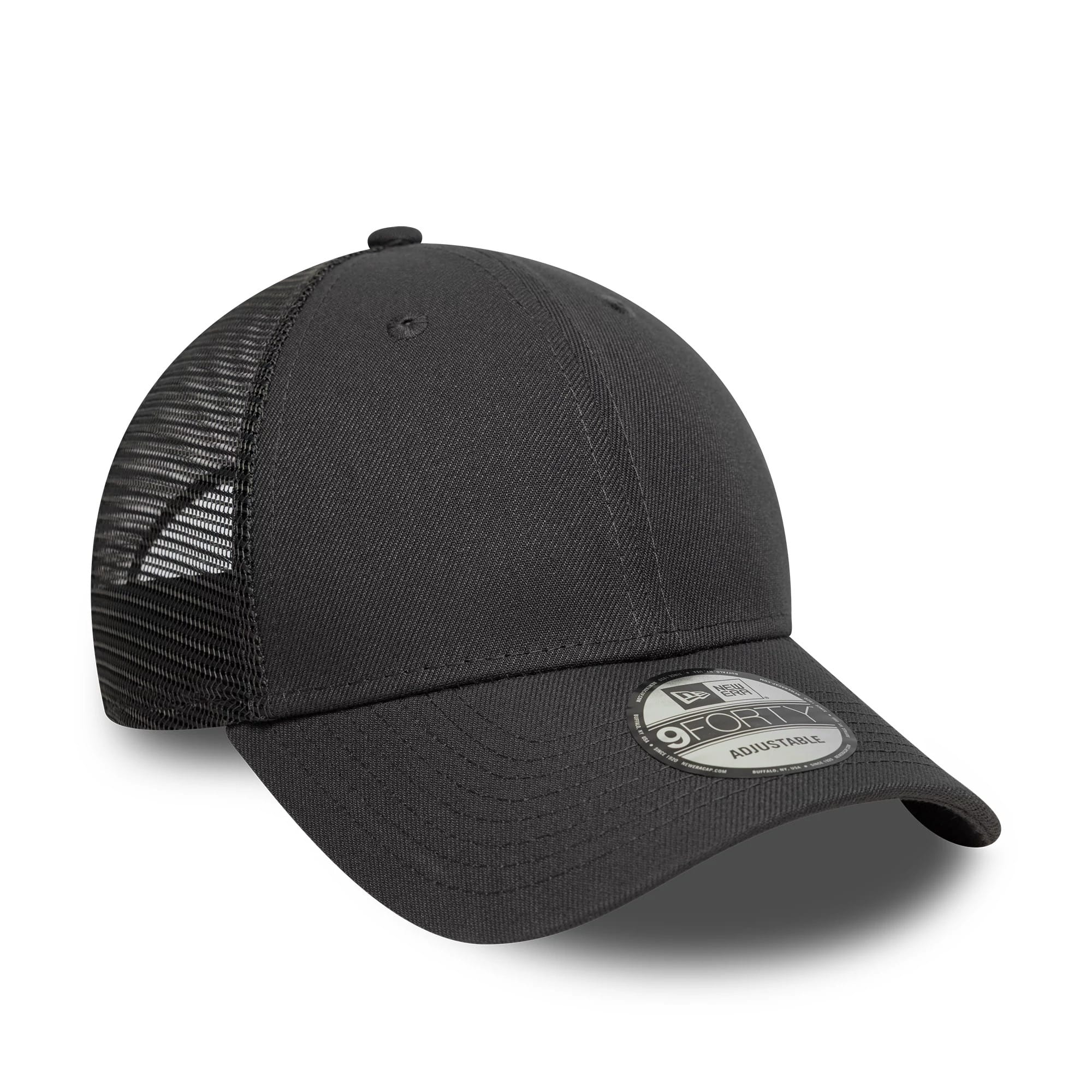 New Era Grey 9FORTY Trucker Adjustable Cap, three-quarter view showing a black mesh back with curved grey visor and a 9FORTY size sticker on the front panels, featuring a structured front crown and embroidered eyelets.