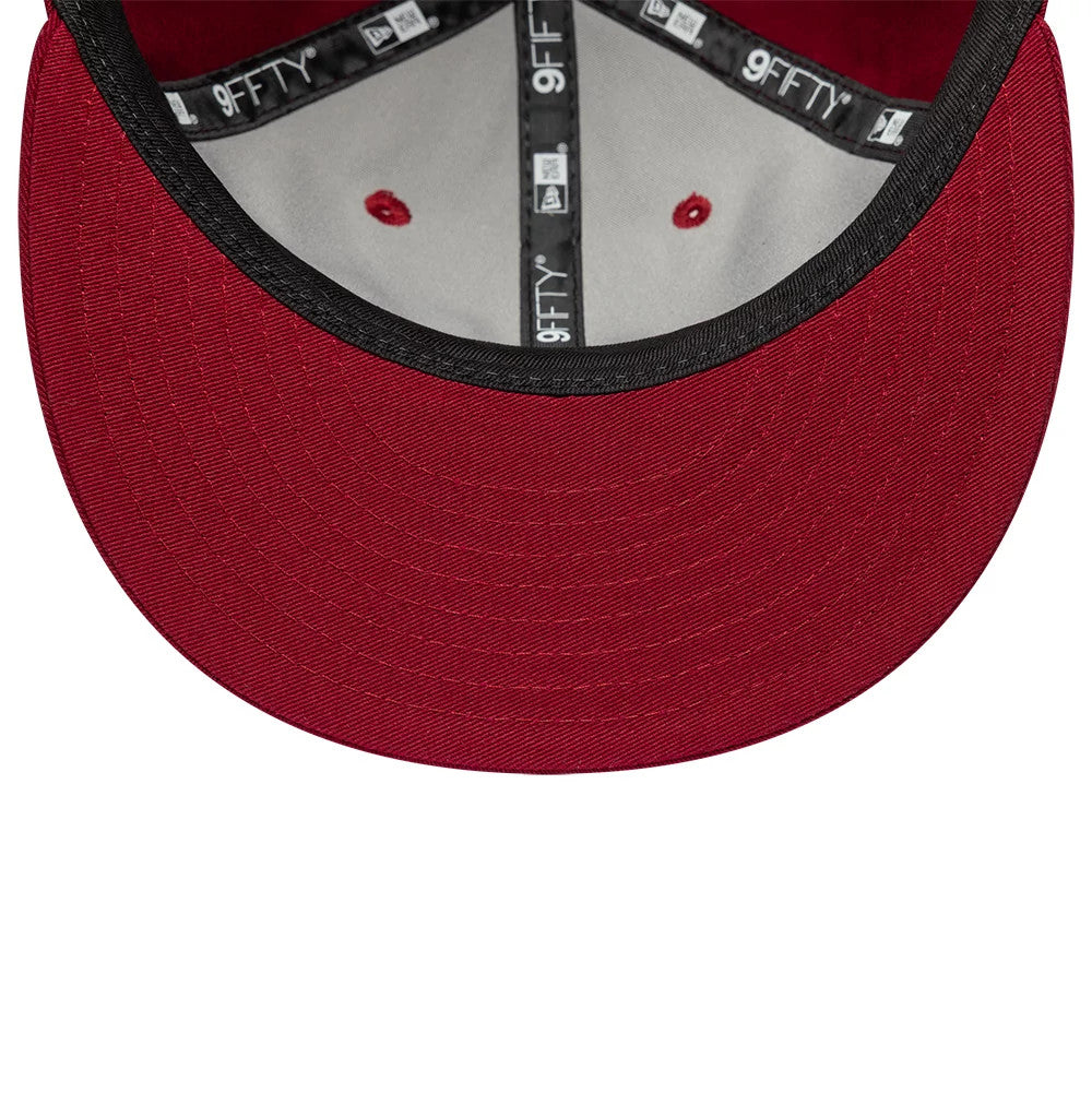 New Era Red Retro Crown 9FIFTY Snapback Adjustable Cap, inside view showing the black taping with white 9FIFTY branding, grey sweatband, and red undervisor with seam stitching and red embroidered eyelets on the crown.