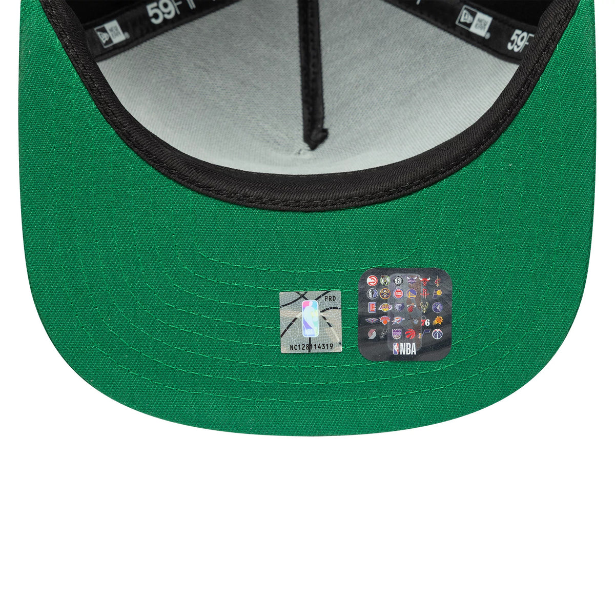 Boston Celtics NBA Flat Black & Green New Era 59FIFTY A-Frame Fitted Cap, inside view showing the green undervisor with two NBA logo stickers, grey sweatband, and black taping marked with the 59FIFTY and New Era logos.