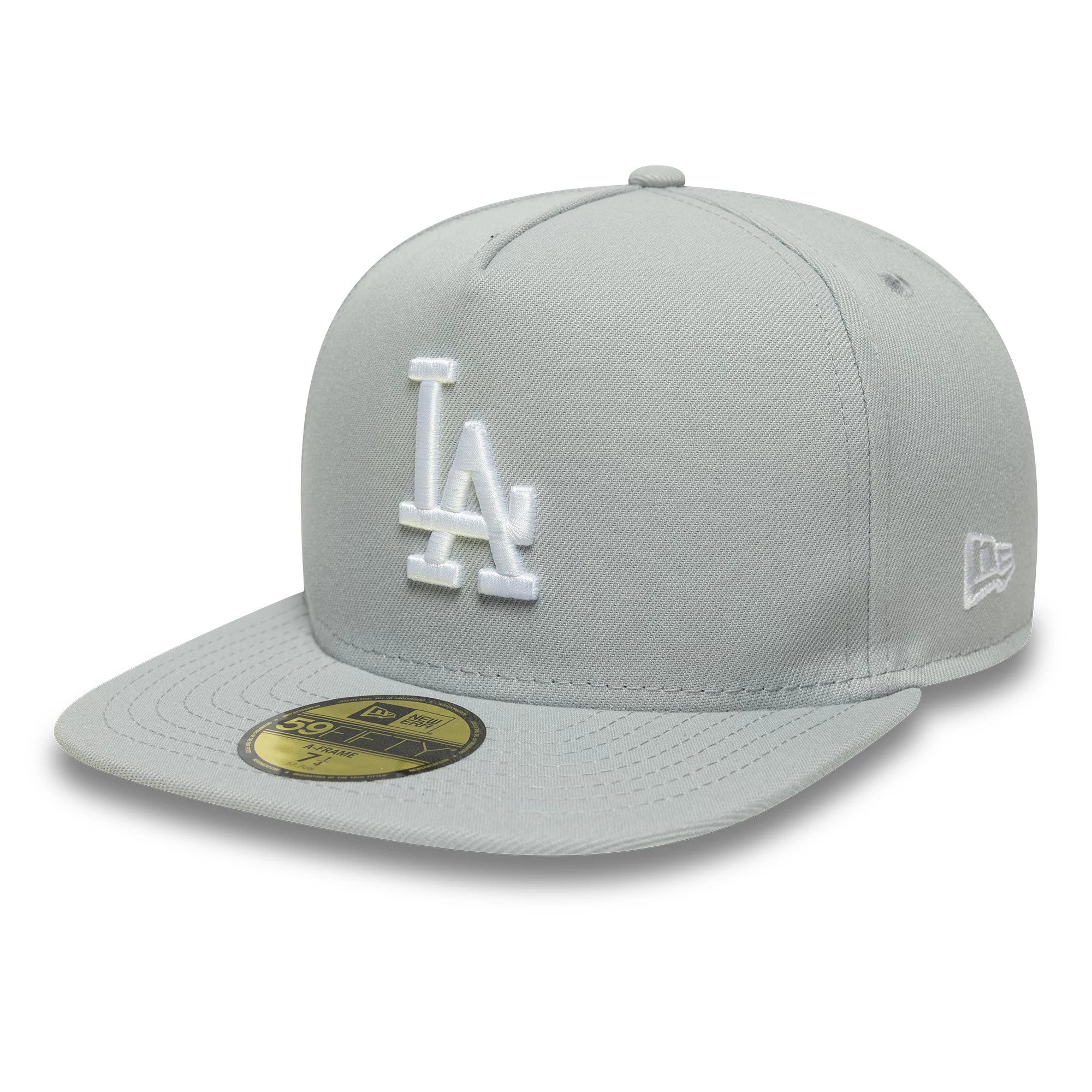 LA Dodgers MLB Flat Grey New Era 59FIFTY A-Frame Fitted Cap, three-quarter view showing the white raised LA logo on the front panel, flat grey visor with a gold 59FIFTY size sticker, and the embroidered New Era flag logo on the left side.