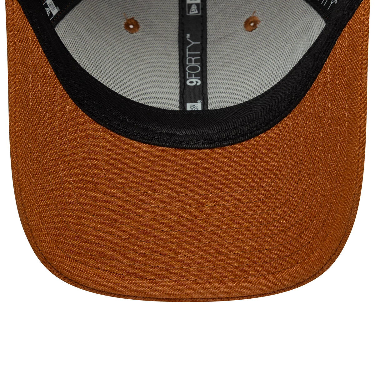 New Era Brown 9FORTY Adjustable Cap, inside view showing brown undervisor with stitching detail, black sweatband encircling the cap interior, and white 9FORTY branding on the black taping alongside eyelets on the crown.