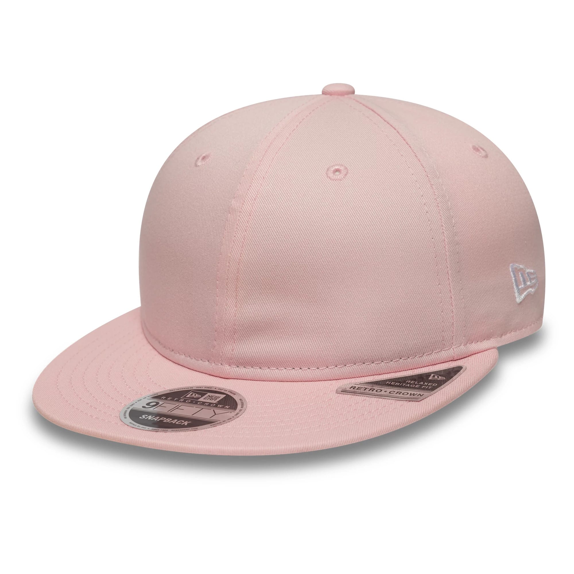 New Era Pink Retro Crown 9FIFTY Snapback Adjustable Cap, three-quarter view showing a light pink structured crown with a curved pink visor, a silver New Era flag logo embroidered on the left side, and a 9FIFTY size sticker on the visor.
