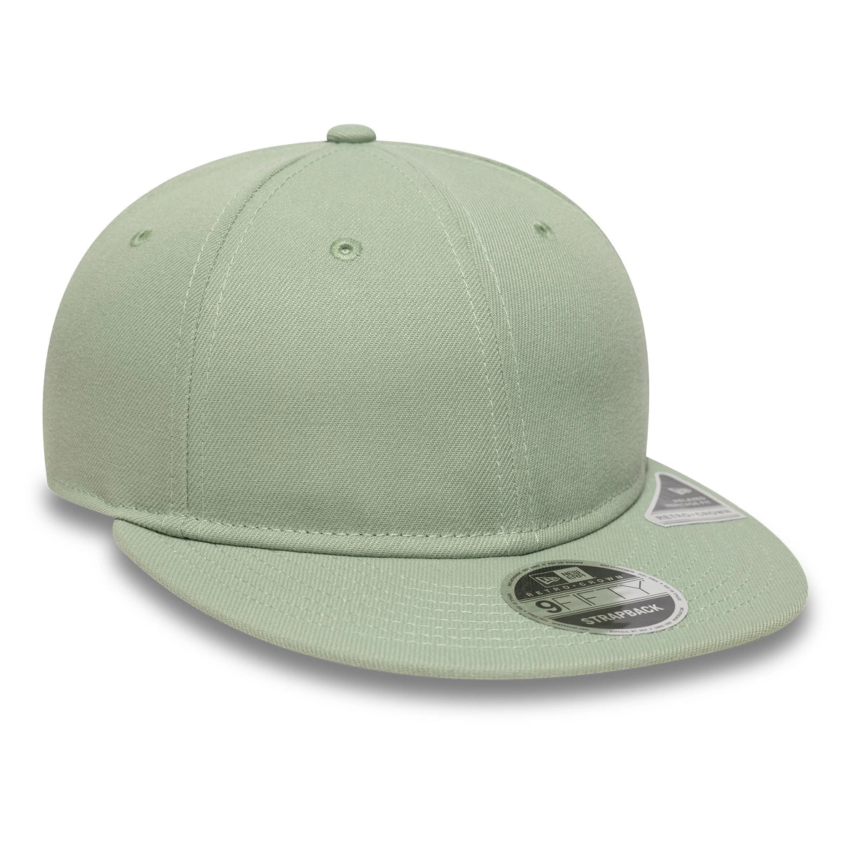 New Era Green Retro Crown 9FIFTY Snapback Adjustable Cap, three-quarter view showing the curved visor with the 9FIFTY size sticker, green fabric with eyelets, and a domed top button for a classic look.