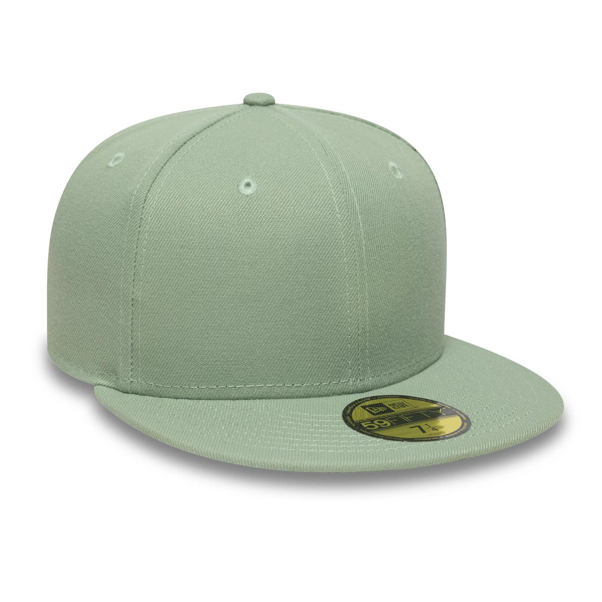 New Era Green 59FIFTY Fitted Cap, three-quarter view showing a solid green structured crown with matching top button and eyelets, flat green visor with a gold 59FIFTY size sticker, and stitching around the panels.