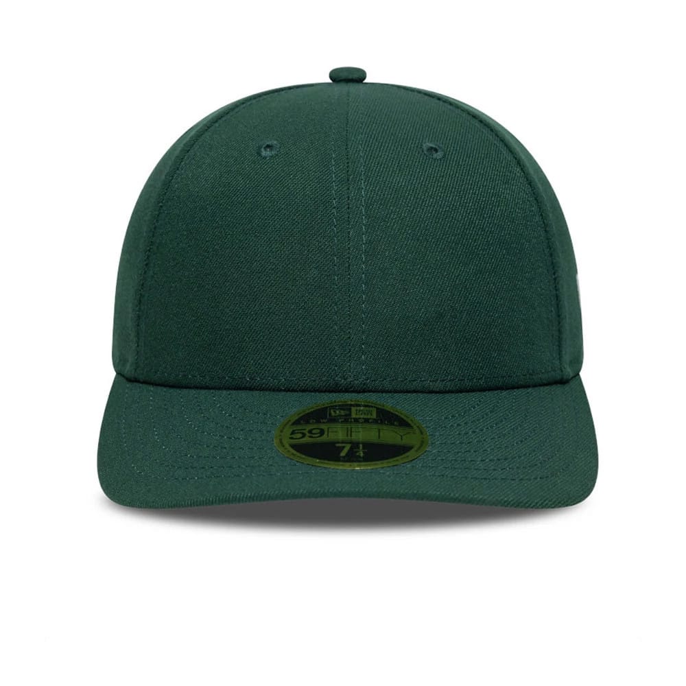 New Era Dark Green Low Profile 59FIFTY Fitted Cap, front view showing a structured dark green crown with matching dark green visor, topped with a small top button and featuring a gold 59FIFTY size sticker centred on the visor.
