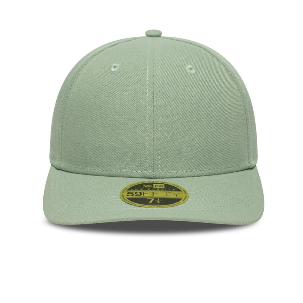 New Era Green Low Profile 59FIFTY Fitted Cap, front view showing the seamless construction with a structured mint green crown and matching stitching, along with the gold 59FIFTY size sticker centred on the curved visor.