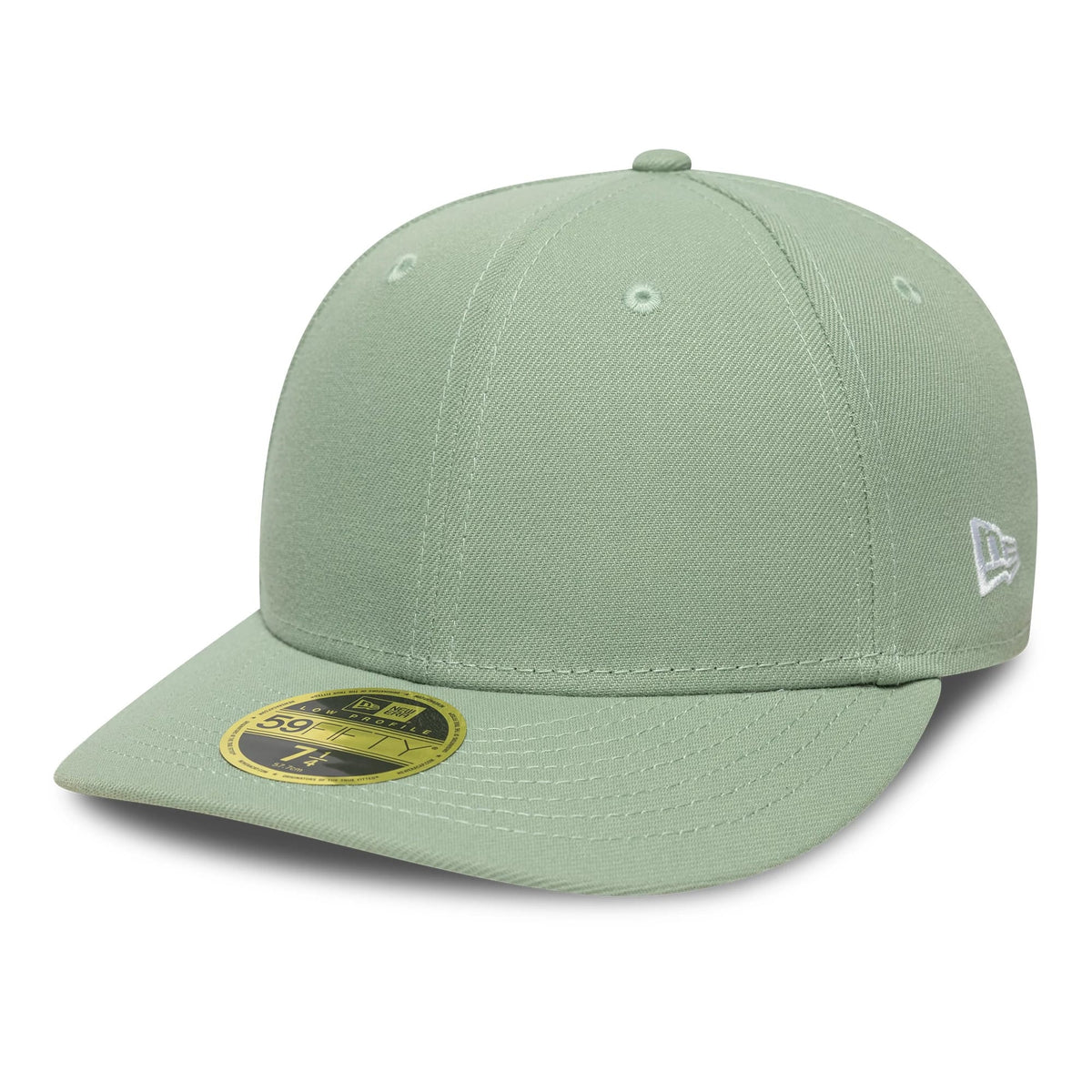 New Era Green Low Profile 59FIFTY Fitted Cap, three-quarter view showing the white embroidered New Era flag logo on the left side of the structured green crown, with a matching curved visor and a gold 59FIFTY size sticker on top.