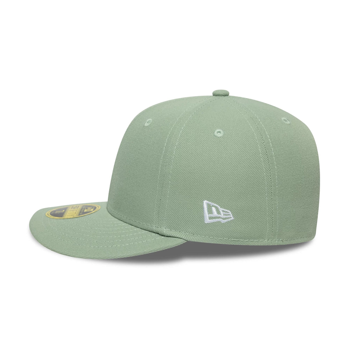 New Era Green Low Profile 59FIFTY Fitted Cap, three-quarter view showing the white embroidered New Era flag logo on the left side, a flat green visor with a gold 59FIFTY size sticker, and a soft-structured crown with matching green eyelets.