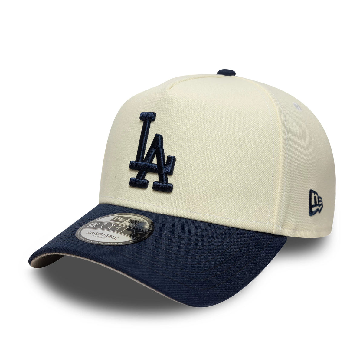 LA Dodgers MLB Chrome Blue Contrast Cream New Era 9FORTY A-Frame Adjustable Cap, three-quarter view showing the raised navy embroidered LA logo on the front cream panel, contrasted with a blue visor and a 9FORTY size sticker on the visor.