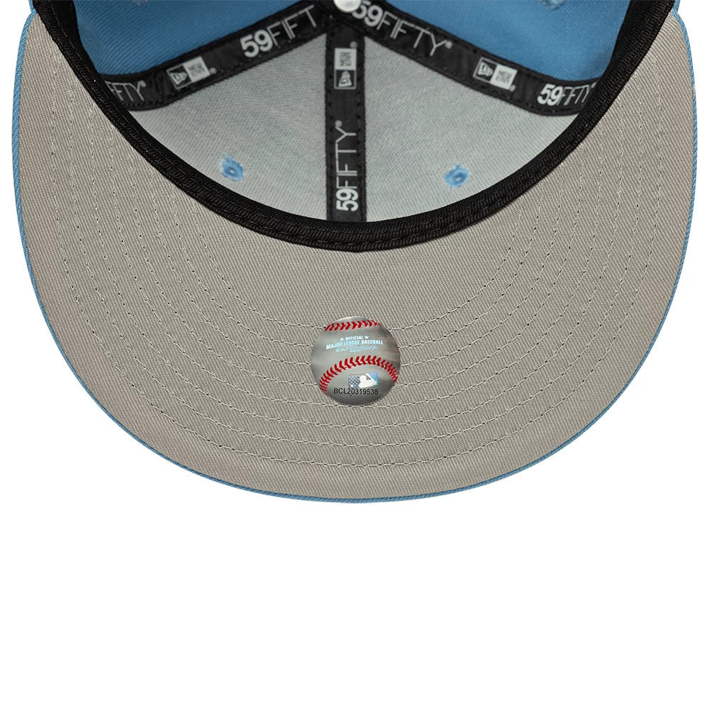 Chicago White Sox MLB Pastel Blue New Era 59FIFTY Fitted Cap, inside view showing the grey undervisor with an official baseball sticker, surrounded by light grey panel lining, black 59FIFTY taping, and the sweatband in contrasting blue.