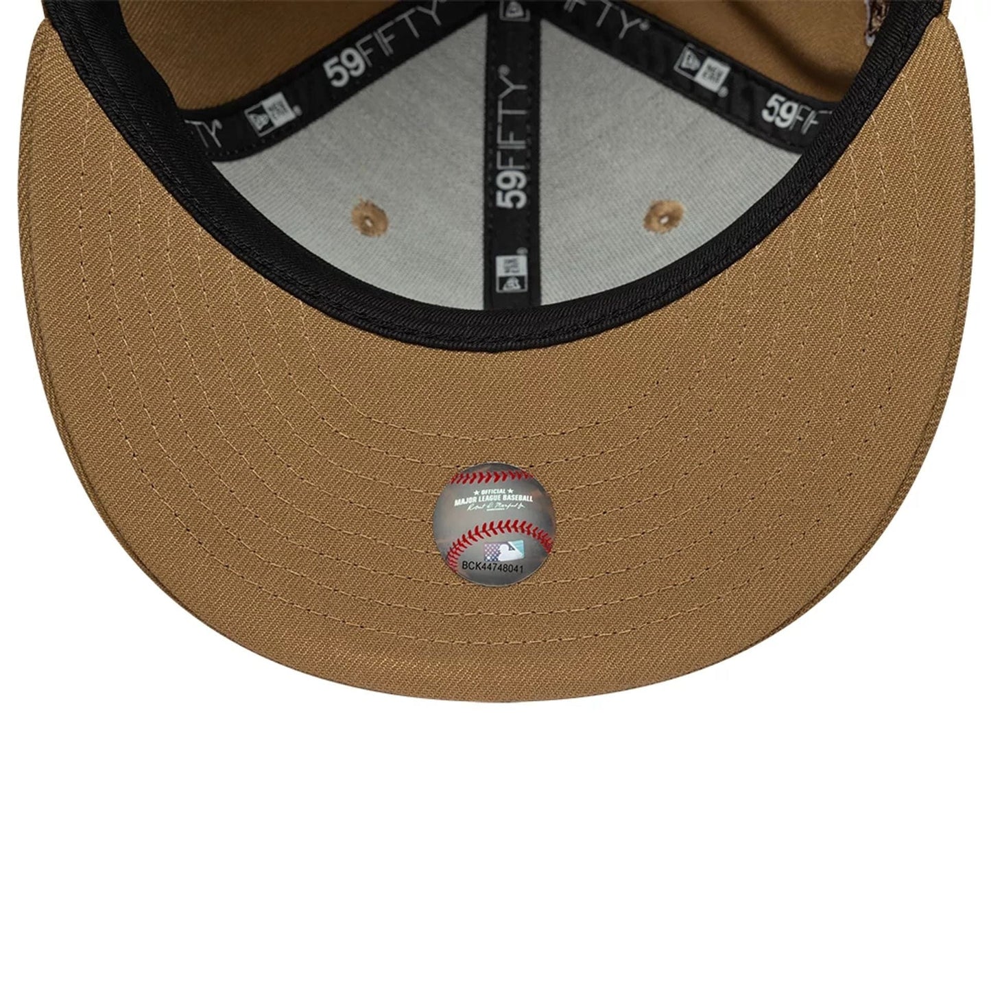 New York Yankees MLB Beige New Era 59FIFTY Fitted Cap, inside view showing black 59FIFTY taping, a grey sweatband, a beige undervisor and a baseball holographic authenticity sticker centred on the underside, highlighting craftsmanship details.