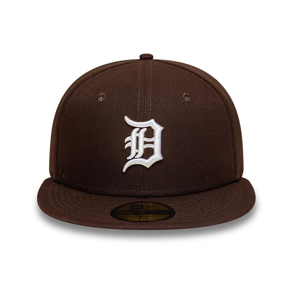 Detroit Tigers MLB Dark Brown New Era 59FIFTY Fitted Cap, front view showing a white embroidered Old English D logo on the structured dark brown crown, with a matching dark brown flat visor and a gold 59FIFTY size sticker on the visor.