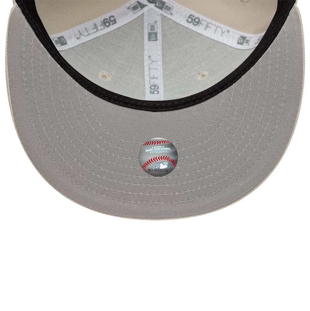 Pictured is this MLB Athletics 59FIFTY Fitted cap in beige. 2
