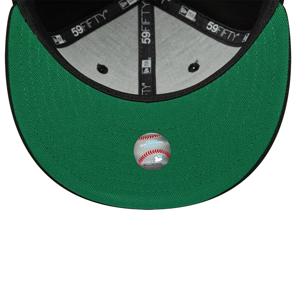 Atlanta Braves MLB Black New Era 59FIFTY Fitted Cap, inside view showing the grey sweatband and black seam taping with white logos, complemented by a green undervisor with a baseball graphic sticker centrally placed near the edge.