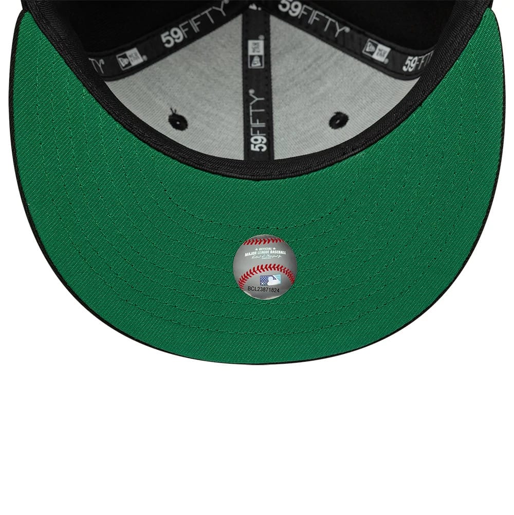 Athletics MLB Black New Era 59FIFTY Fitted Cap, inside view showing a green undervisor with a baseball-themed sticker, contrasted by the grey sweatband and black taping featuring multiple 59FIFTY logos.
