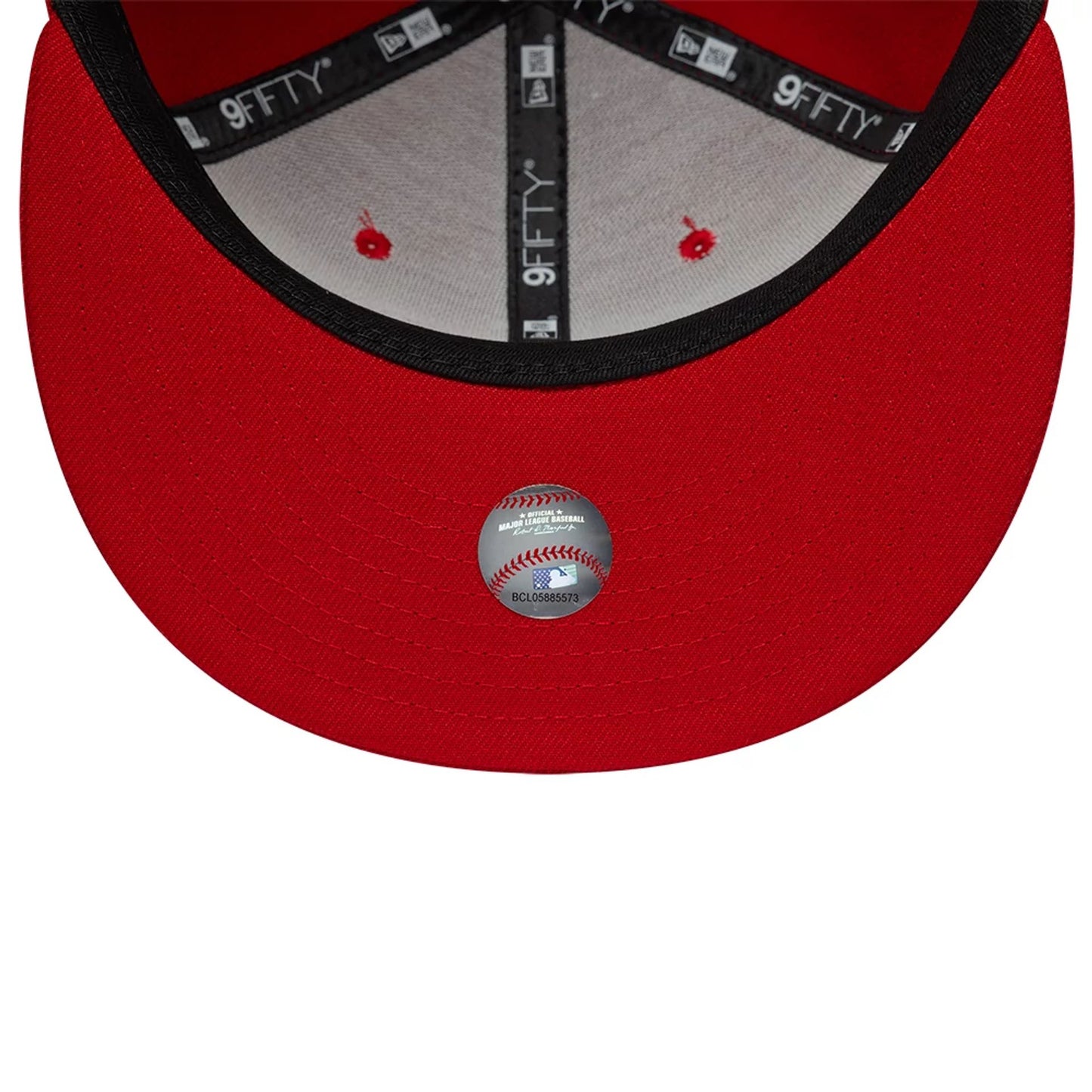 Philadelphia Phillies MLB Upside Down Red New Era 9FIFTY Snapback Cap, inside view showing the black taping with white 9FIFTY lettering, grey sweatband, and a baseball-themed sticker on the red undervisor near the edge of the cap.