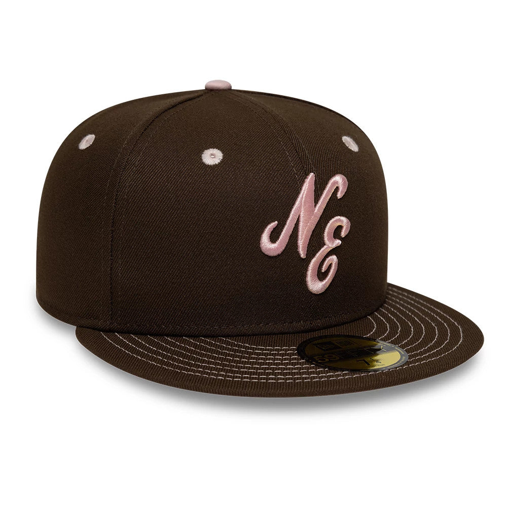 New Era With Love Dark Brown 59FIFTY Fitted Cap, front view showing the pink raised embroidered NE letters on the structured dark brown crown, pink eyelets and top button, and a black 59FIFTY size sticker on the flat dark brown visor.