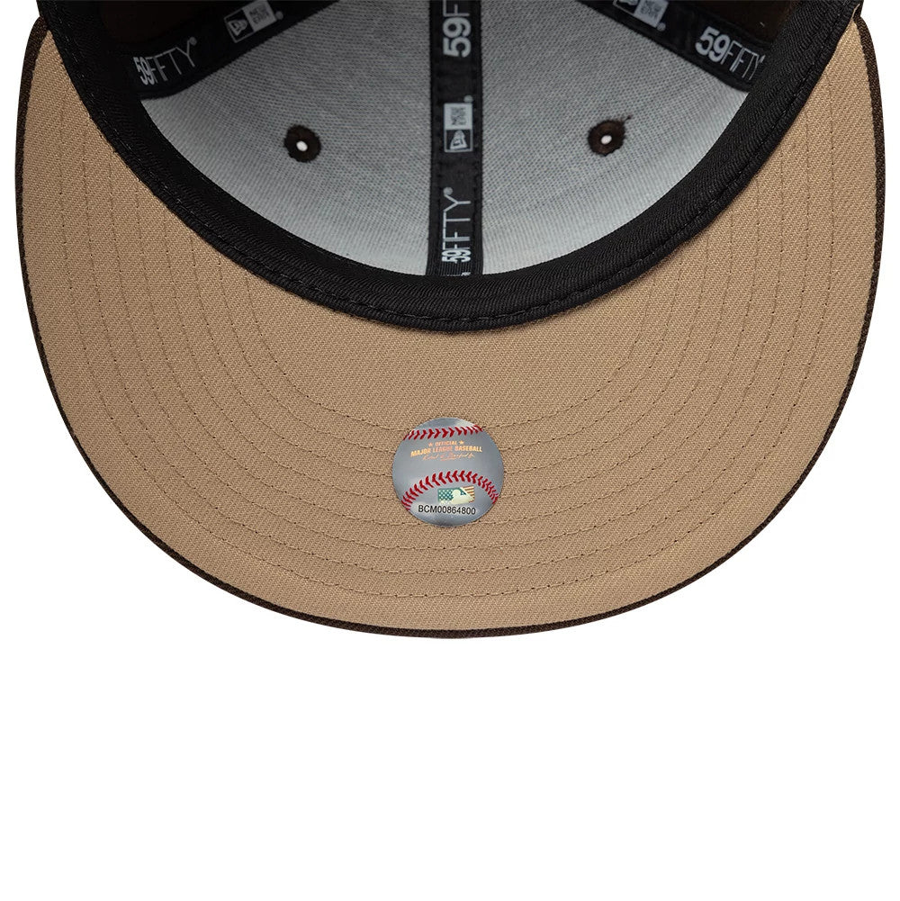 Chicago White Sox MLB Floral Dark Brown New Era 59FIFTY Fitted Cap, inside view showing the grey undervisor with a clear MLB sticker, black taping marked with 59FIFTY branding, and inner crown panels in a contrasting light grey fabric.