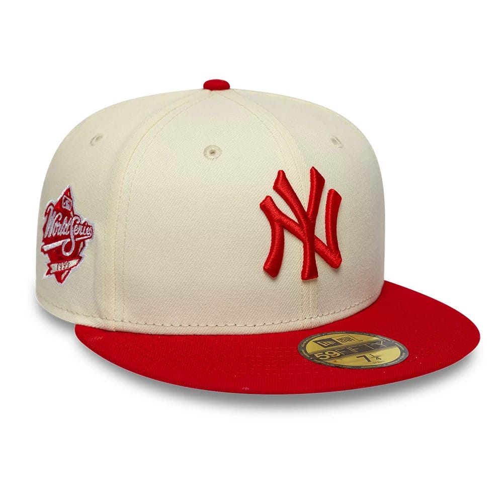 New York Yankees MLB Chrome Scarlet Cream New Era 59FIFTY Fitted Cap, three-quarter view showing the red embroidered NY logo on the front panel, a scarlet visor with a gold 59FIFTY size sticker, and a World Series patch on the left side.