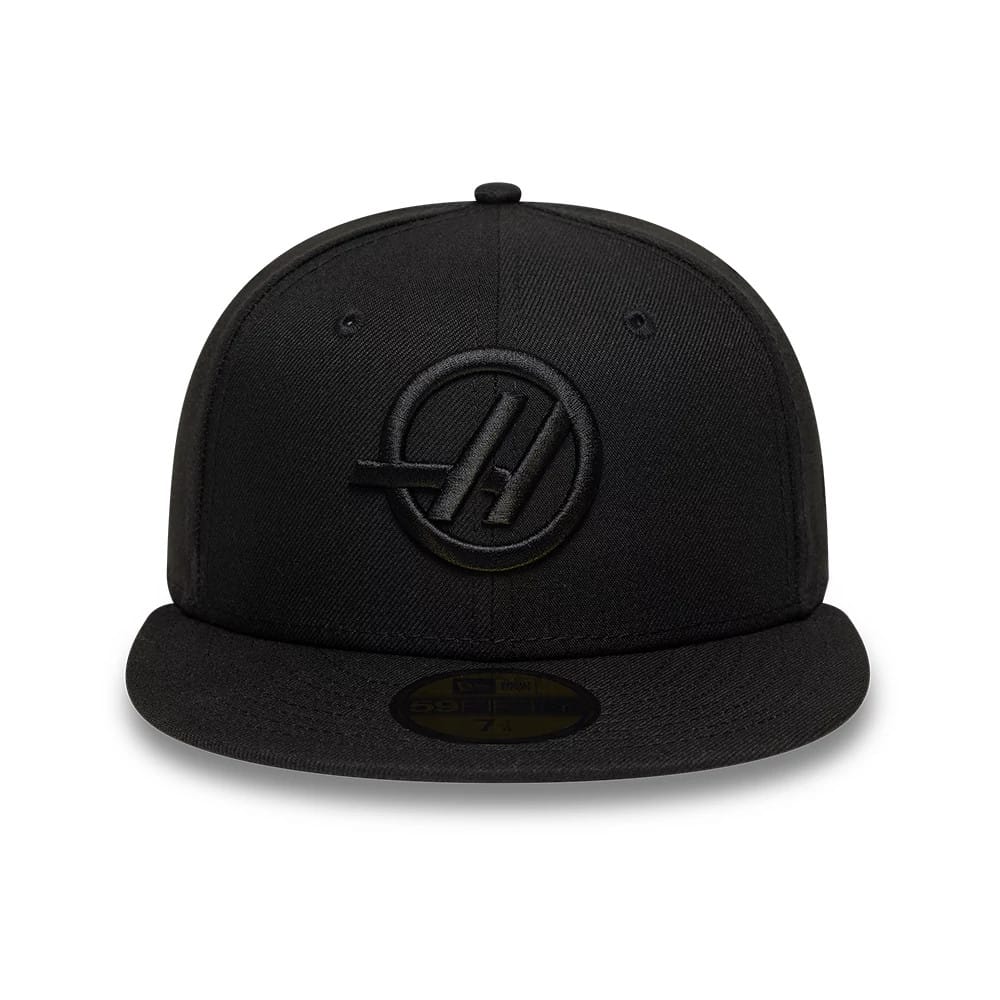 TGR Haas F1 Black New Era 59FIFTY Fitted Cap, front view showing a black raised embroidered TGR Haas logo on the front panel, a curved black visor, and a gold 59FIFTY size sticker on top of the visor.