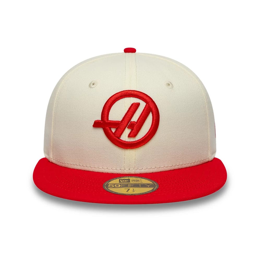 TGR Haas F1 Cream & Red New Era 59FIFTY Fitted Cap, front view showing an embroidered red circular logo on the cream front panel, paired with a bright red flat visor and a gold 59FIFTY size sticker on the top.