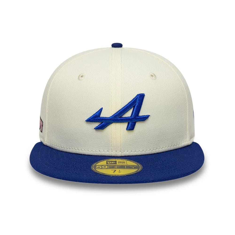 Alpine Racing Cream & Blue New Era 59FIFTY Fitted Cap, front view showing the blue raised embroidered A logo on the cream front panels, a contrasting blue flat visor with a gold 59FIFTY size sticker, and a blue top button.