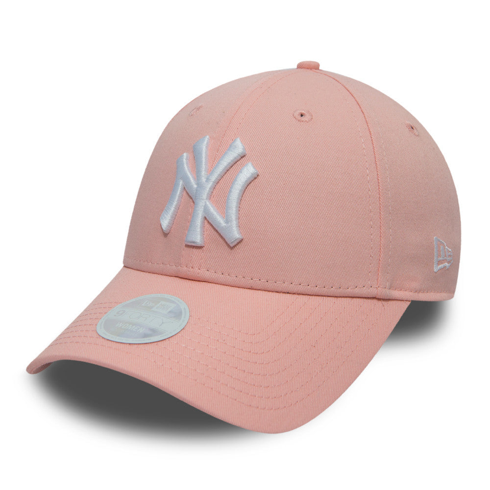 New York Yankees Essential Womens Pink New Era 9FORTY Cap, three-quarter view showing the raised white Yankees logo on the front panel, a matching pink curved visor with a 9FORTY size sticker, and the New Era flag logo on the left side.