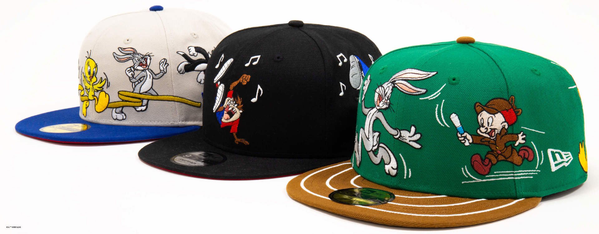 three lined up 59FIFTY caps with looney tunes characters 