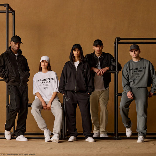 a group of models wearing nba clothing, including caps, hoodies and joggers