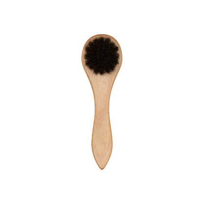 This is a New Era Wooden Cap Brush 2