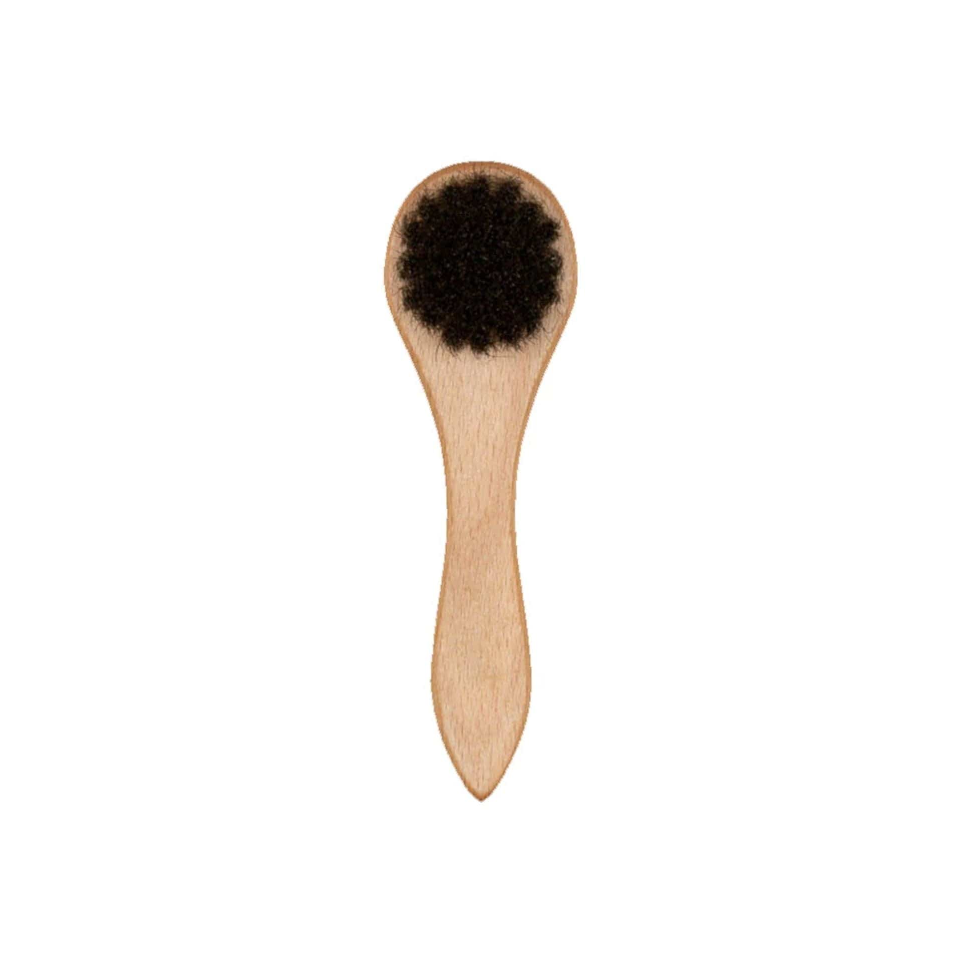 This is a New Era Wooden Cap Brush 2