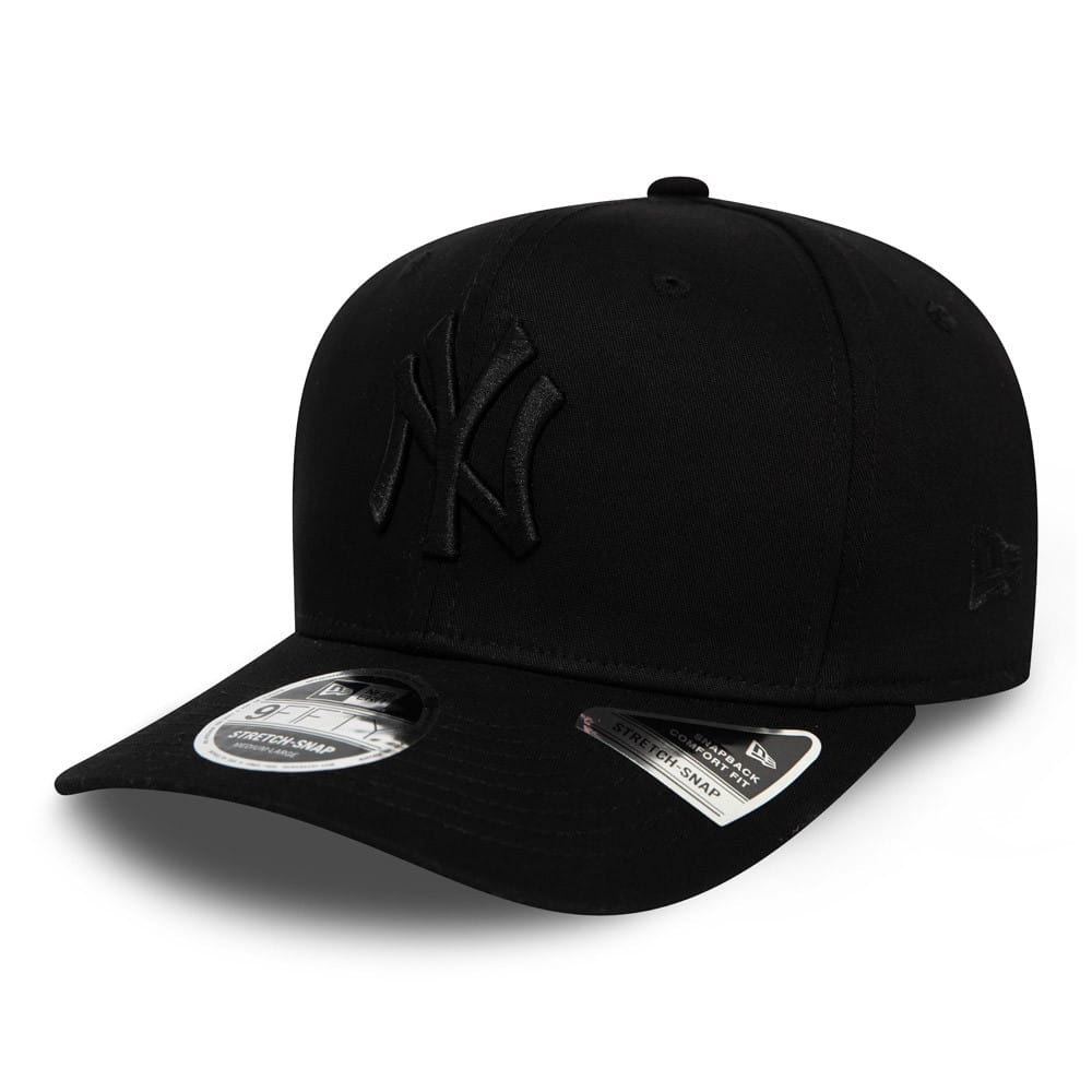 New York Yankees Tonal Black New Era 9FIFTY Stretch Snap Cap, three-quarter view showing the raised black embroidered NY logo on the front panel, with a 9FIFTY size sticker on the visor and the New Era flag logo on the left side.
