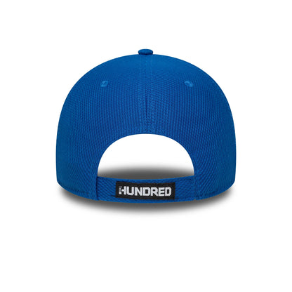 London Spirit The Hundred 2025 Diamond Era Blue New Era 9FORTY Cap, rear view showing The Hundred wordmark in white and black on a fabric strap, with a blue top button and eyelets on the textured crown.