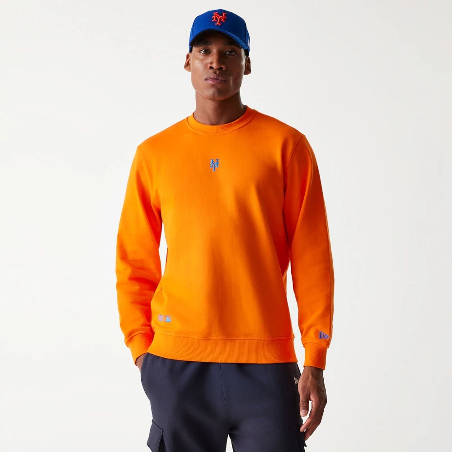 The Male model is wearing New York Mets Korea Orange Sweatshirt 1