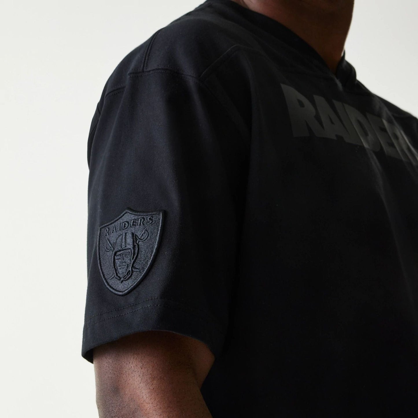 The Male model is wearing Las Vegas Raiders Tonal Pack Black T-Shirt 6