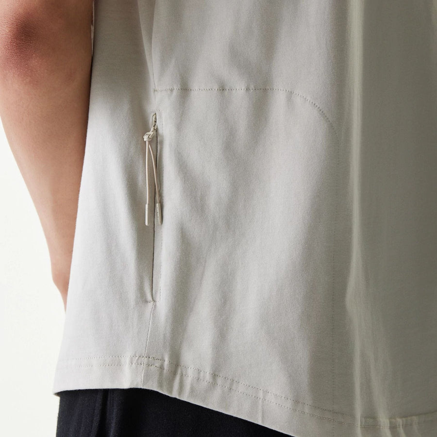 The Male model is wearing New Era Outdoor Earth Day Stone Side Pocket T-Shirt 6