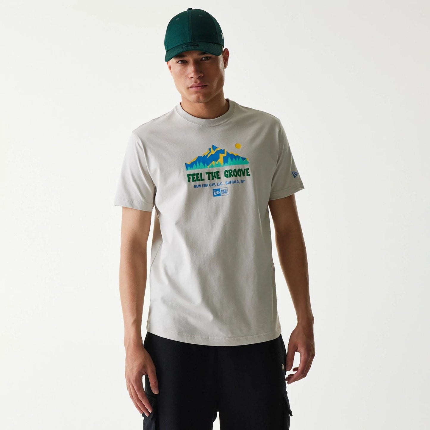The Male model is wearing New Era Outdoor Earth Day Stone Side Pocket T-Shirt 1
