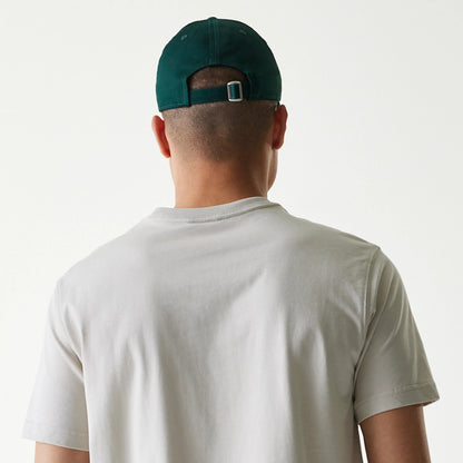The Male model is wearing New Era Outdoor Earth Day Stone Side Pocket T-Shirt 7