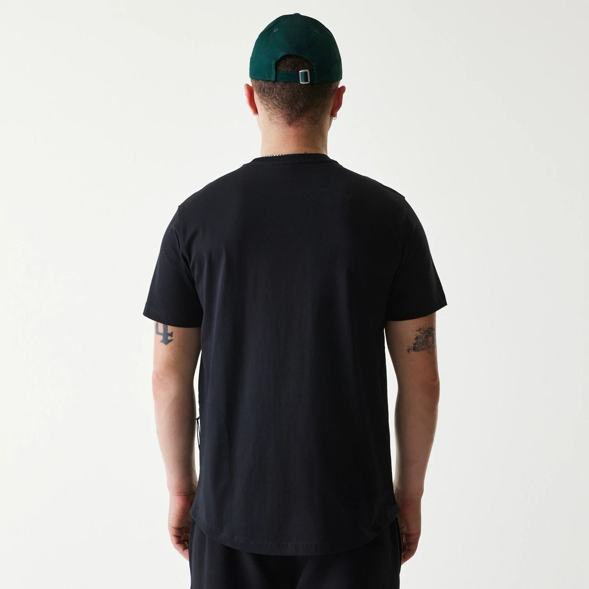 The Male model is wearing New Era Outdoor Earth Day Black T-Shirt 2